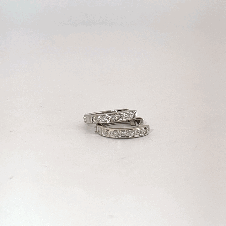 14K White Gold Diamond Hoop Earrings, female style, channel-set diamonds.