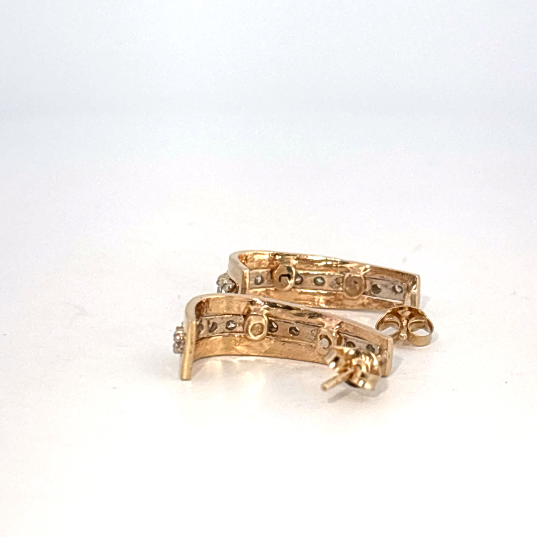 14K Yellow Gold Earrings, set with a row of small Round Diamonds.