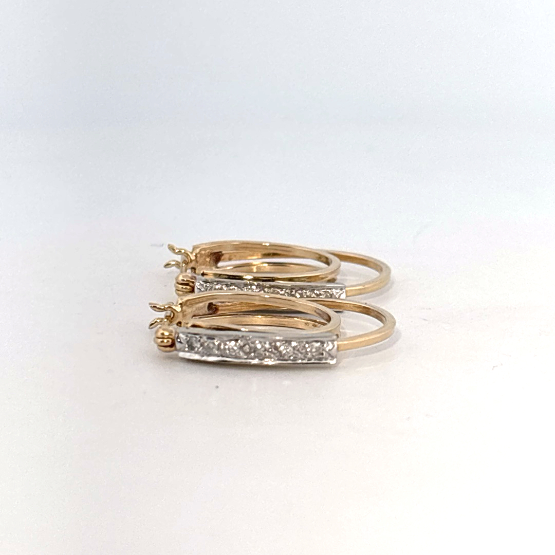 14K Dual White/Yellow Gold Earrings, set with Diamonds in a hinged hoop style.