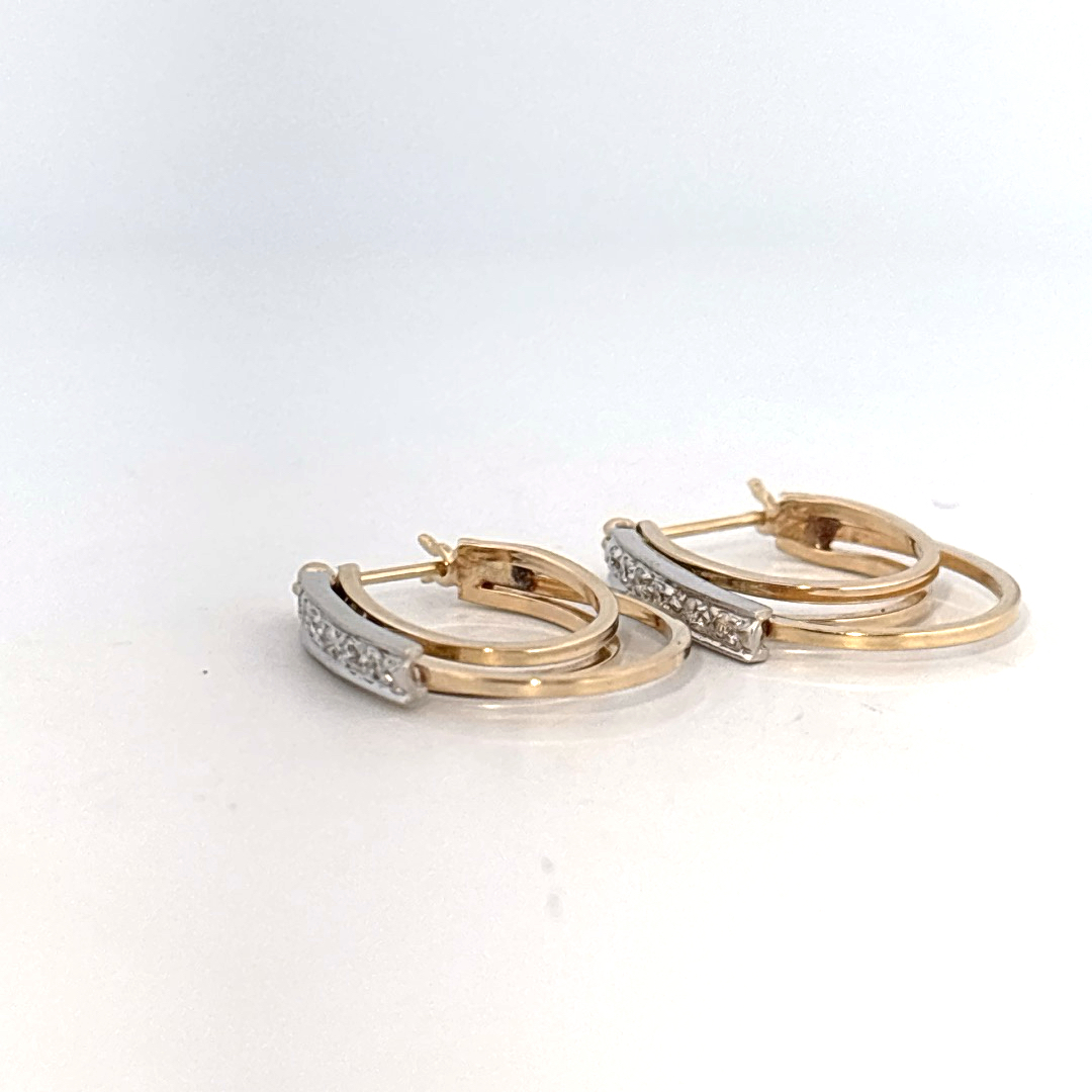 14K Dual White/Yellow Gold Earrings, set with Diamonds in a hinged hoop style.