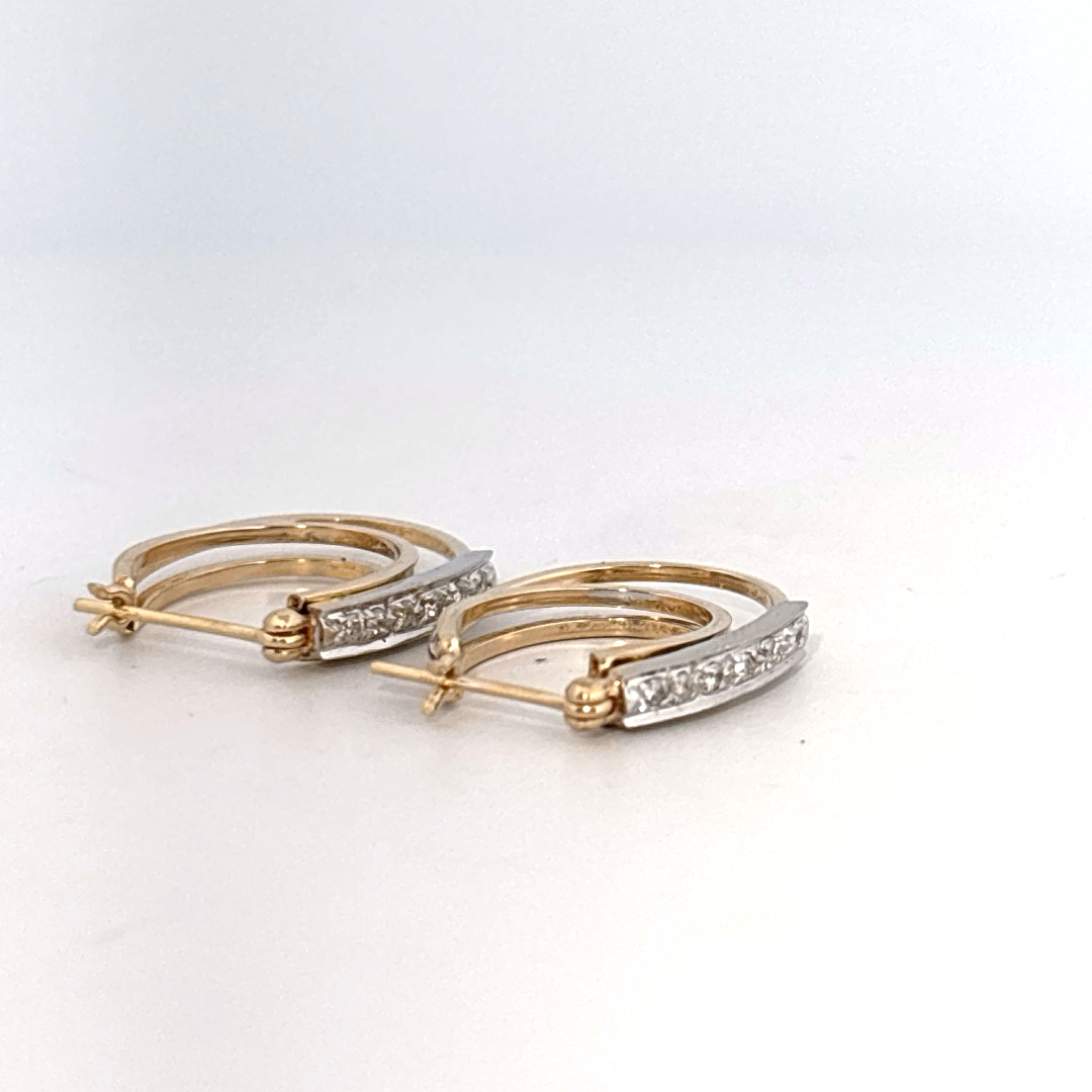 14K Dual White/Yellow Gold Earrings, set with Diamonds in a hinged hoop style.