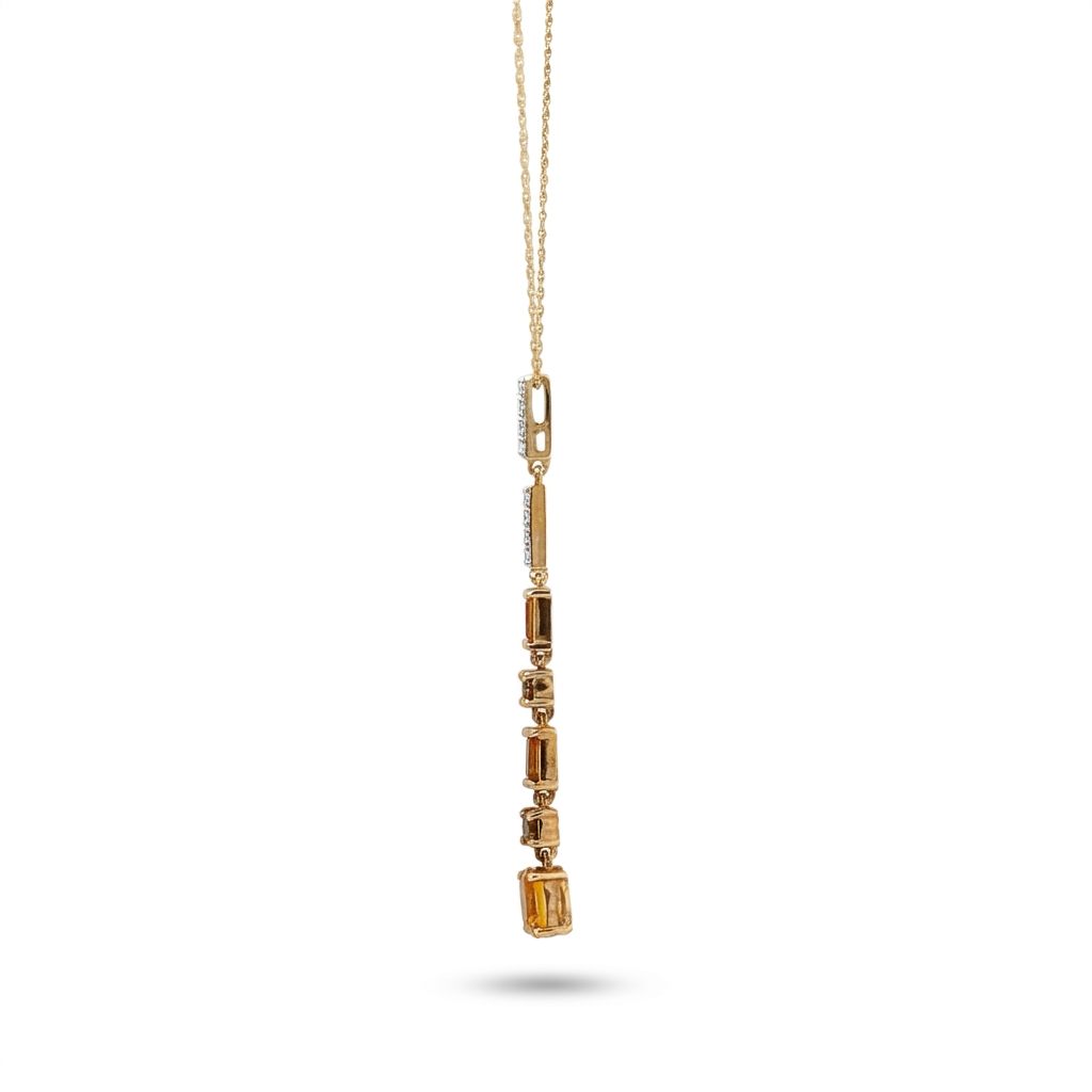 14K Yellow gold necklace with mixed color Citrines and white topaz in bale.