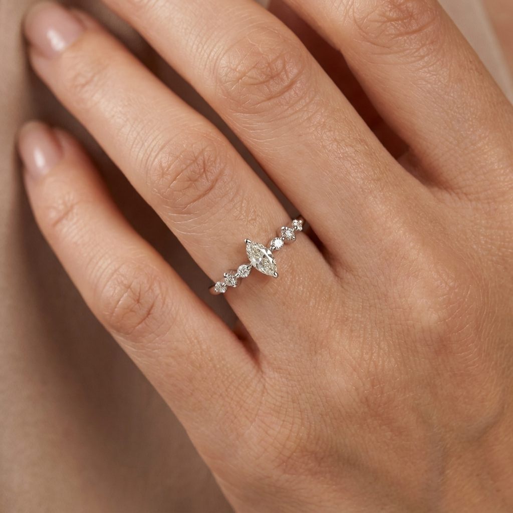 Platinum 900 Engagement Ring, size 6, set with 1 Marquise Diamond (0.28ct, I, SI2) and 6 Round Diamonds (0.15ct total, G, SI1).