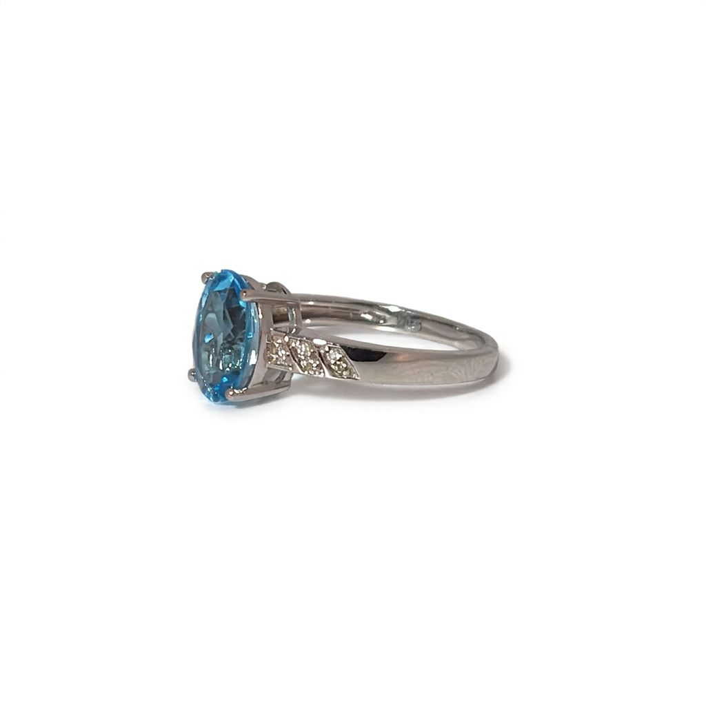 Ladies Ring, Natural Diamonds (0.03CTW) with Natural Blue Topaz 9x7mm, 10K White Gold
