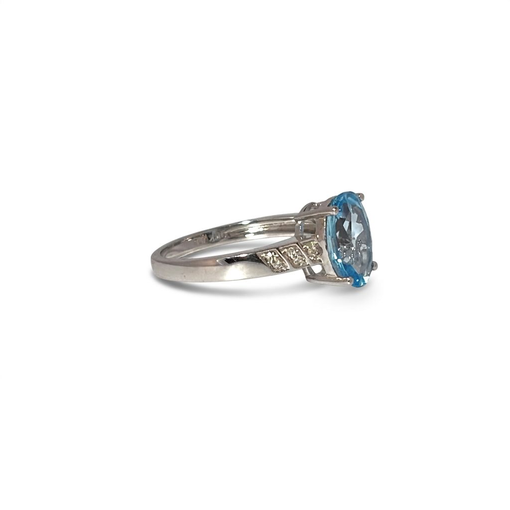 Ladies Ring, Natural Diamonds (0.03CTW) with Natural Blue Topaz 9x7mm, 10K White Gold