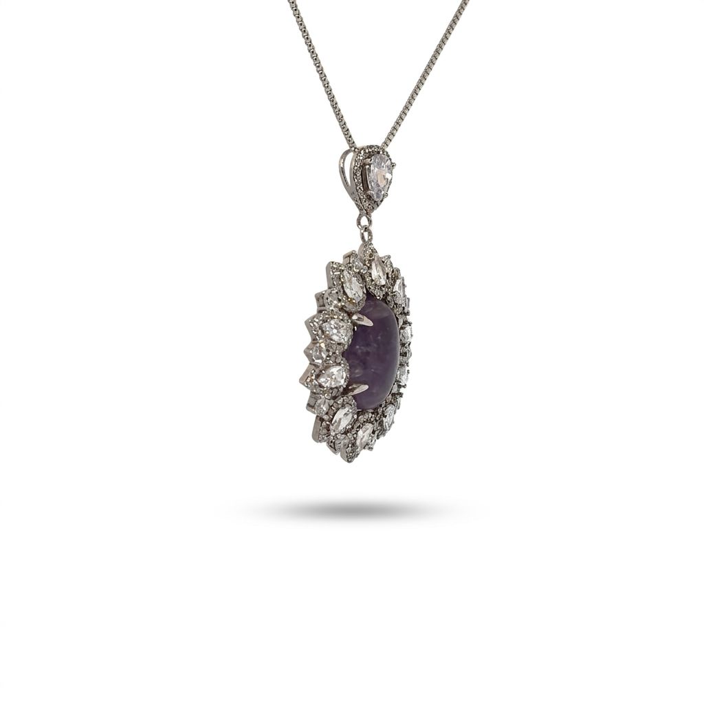 Sterling Silver Necklace, set with 1 Oval Lapis Lazuli and surrounded by multiple Clear Pear-shaped stones.