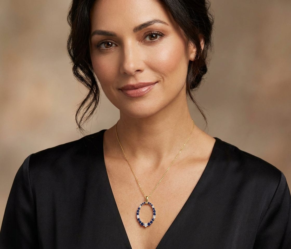 14K Yellow Gold Pendant Chain, set with 18 Round Blue Sapphires (0.52ct, Eye Clean) and 5 Round Diamonds (0.16ct, G, SI1).