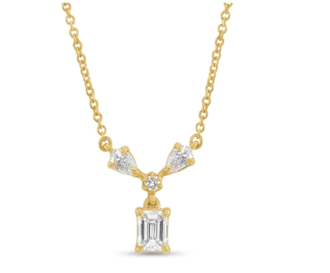 14K Yellow Gold Necklace, set with 1 Emerald Cut Diamond (0.31ct, G, VS2), 2 Pear Cut Diamonds (0.16ct total, G, SI1), and 1 Round Diamond (0.03ct, G, SI1).
