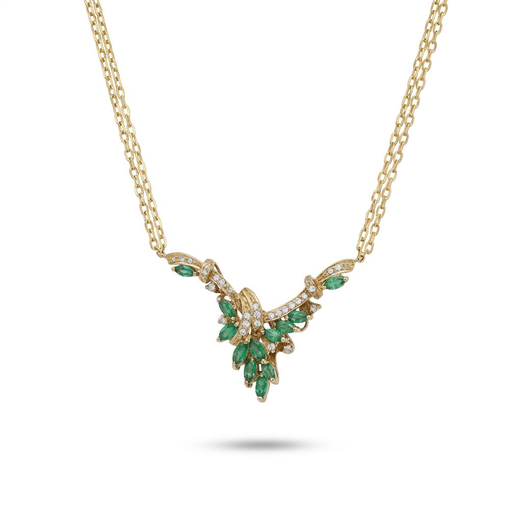 Female Necklace, 14K Yellow Gold featuring marquise-cut Emeralds (1.2ct, Eye Clean) and round Diamonds (0.15ct, G SI1) in a leaf motif.