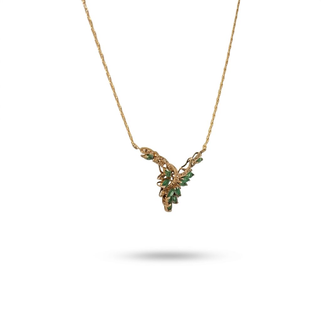 Female Necklace, 14K Yellow Gold featuring marquise-cut Emeralds (1.2ct, Eye Clean) and round Diamonds (0.15ct, G SI1) in a leaf motif.