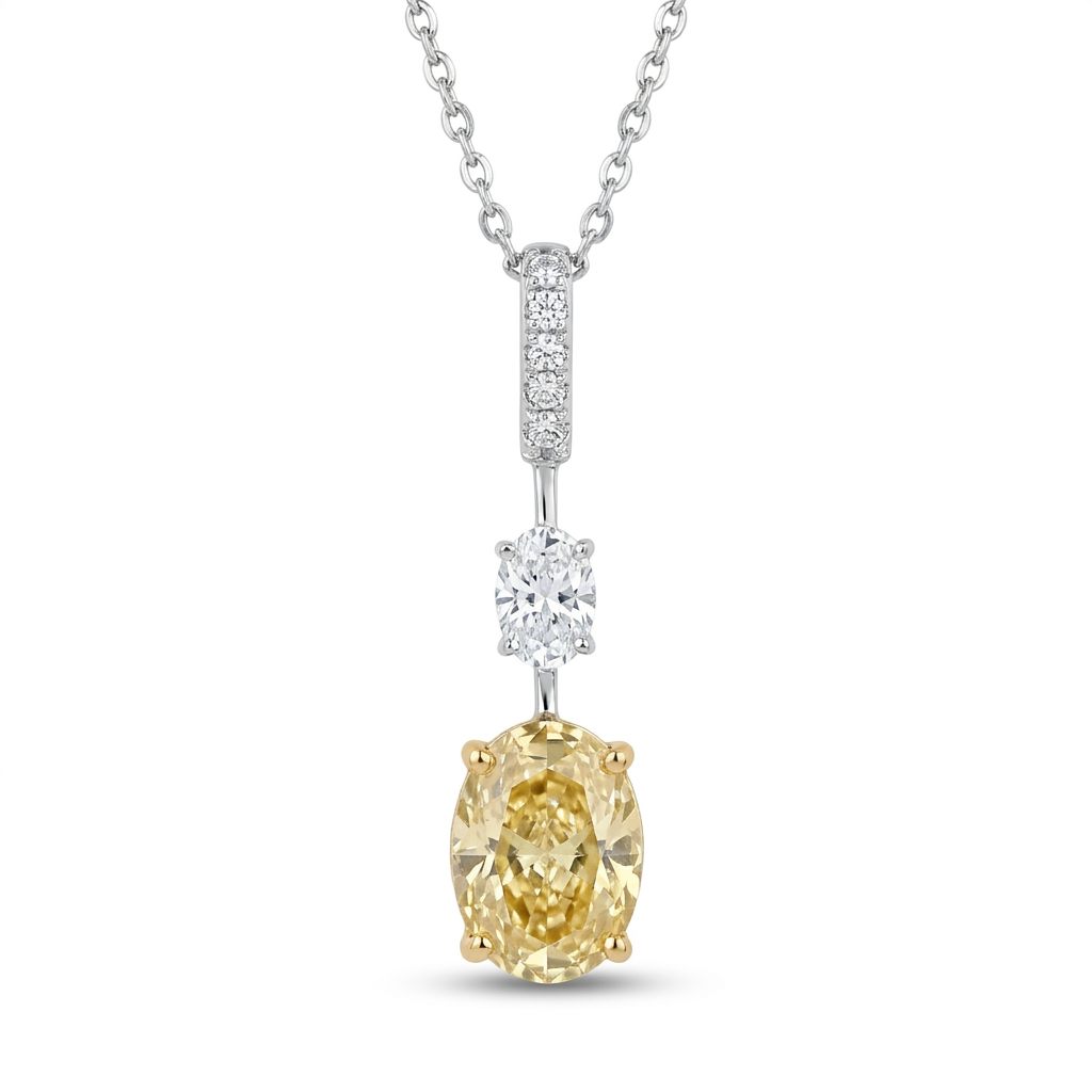18K White/Yellow Gold Pendant, set with 1 Oval Fancy Yellow Lab Grown Diamond (2.1ct, VS1), 1 Oval Colorless Lab Grown Diamond (0.5ct, VVS1), and 6 Round Near Colorless Lab Grown Diamonds (0.06ct total, VS1).