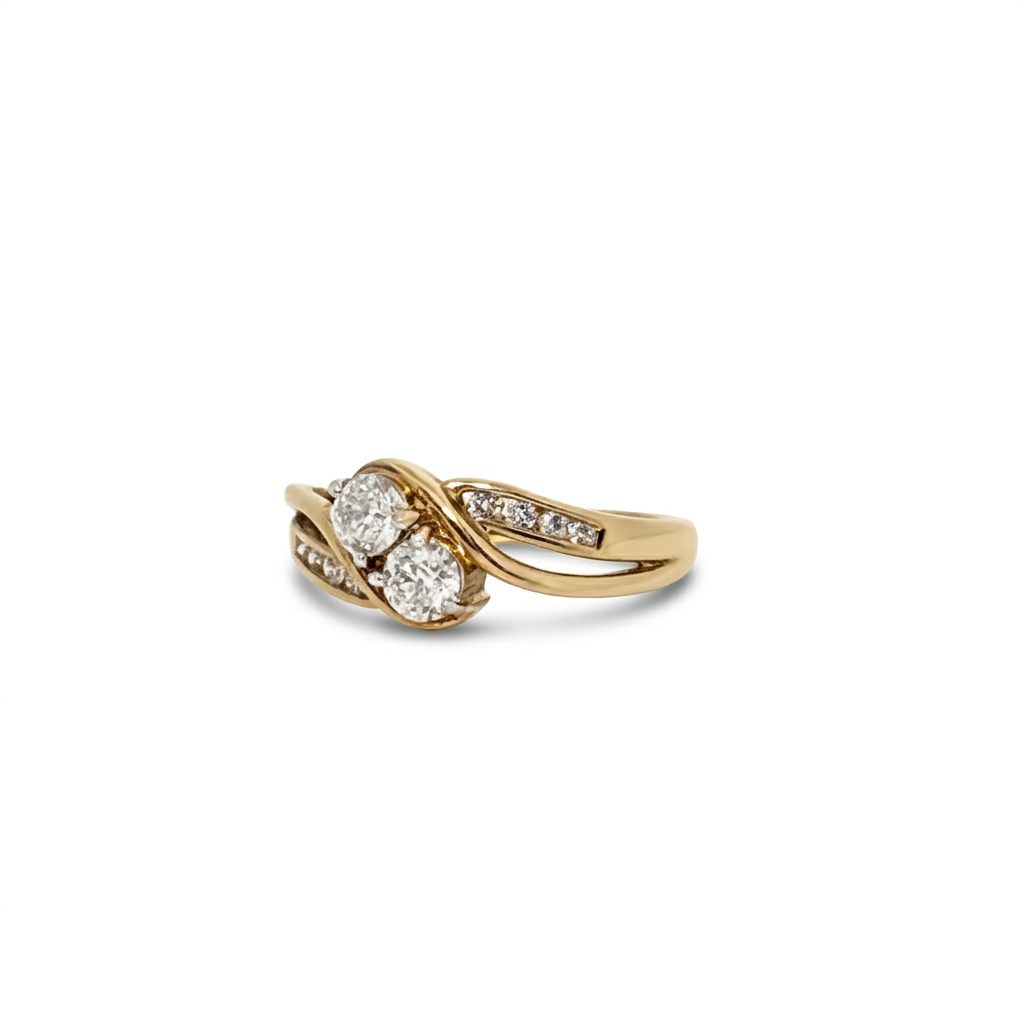 10K Yellow Gold Engagement Ring, set with 2 Round Diamonds (0.65ct, G, SI1) and 8 Round Diamonds (0.10ct total)