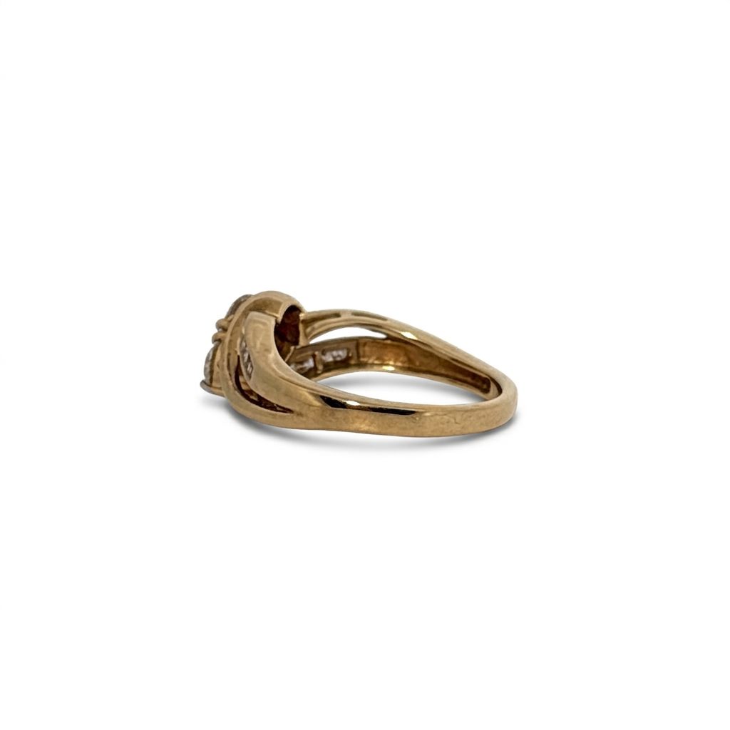 10K Yellow Gold Engagement Ring, set with 2 Round Diamonds (0.65ct, G, SI1) and 8 Round Diamonds (0.10ct total)