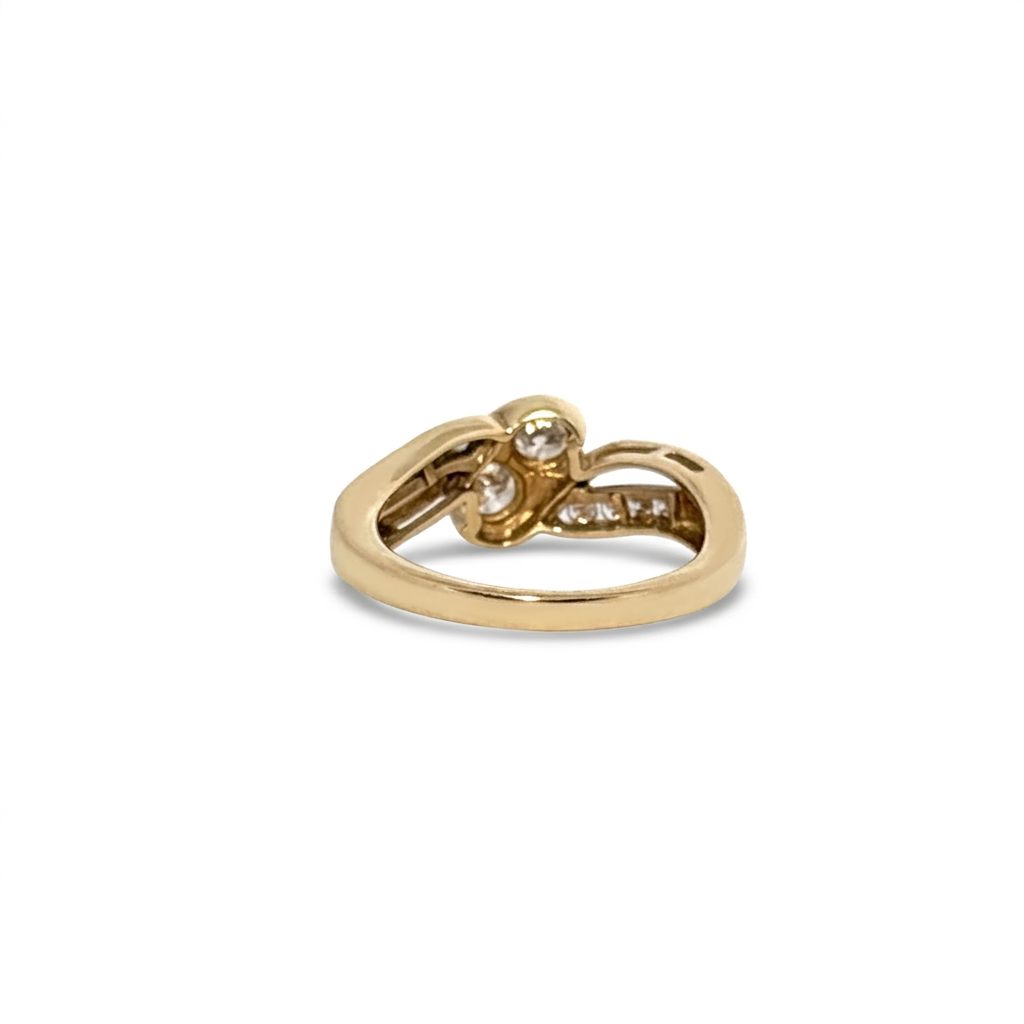 10K Yellow Gold Engagement Ring, set with 2 Round Diamonds (0.65ct, G, SI1) and 8 Round Diamonds (0.10ct total)