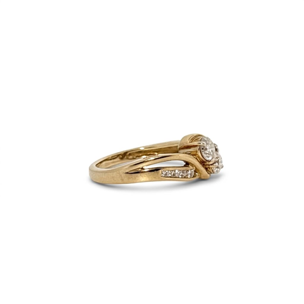 10K Yellow Gold Engagement Ring, set with 2 Round Diamonds (0.65ct, G, SI1) and 8 Round Diamonds (0.10ct total)