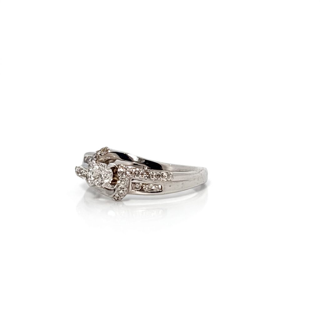 14K White Gold Engagement Ring, set with 1 Round Diamond (0.25ct, G, Slightly Included) and multiple smaller Diamonds (total 0.37ct), Size 7.