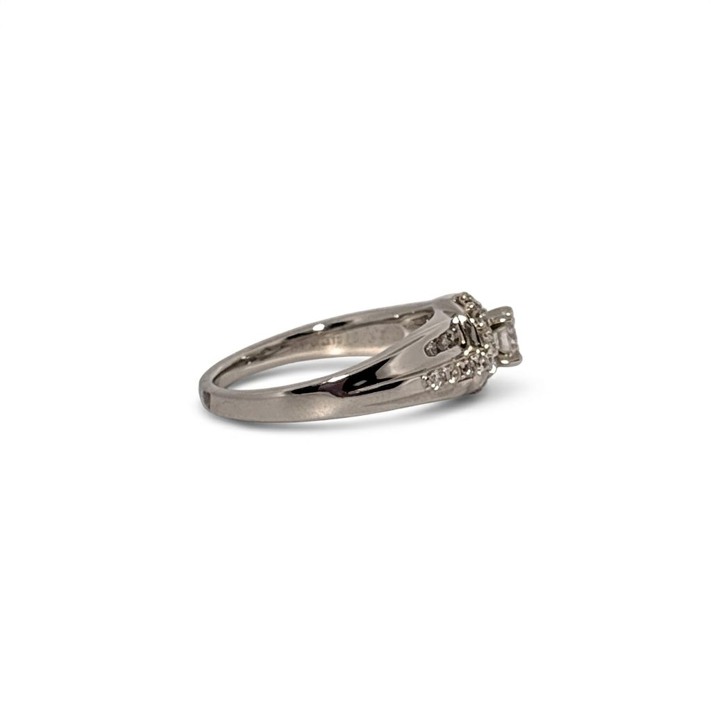 14K White Gold Engagement Ring, set with 1 Round Diamond (0.25ct, G, Slightly Included) and multiple smaller Diamonds (total 0.37ct), Size 7.