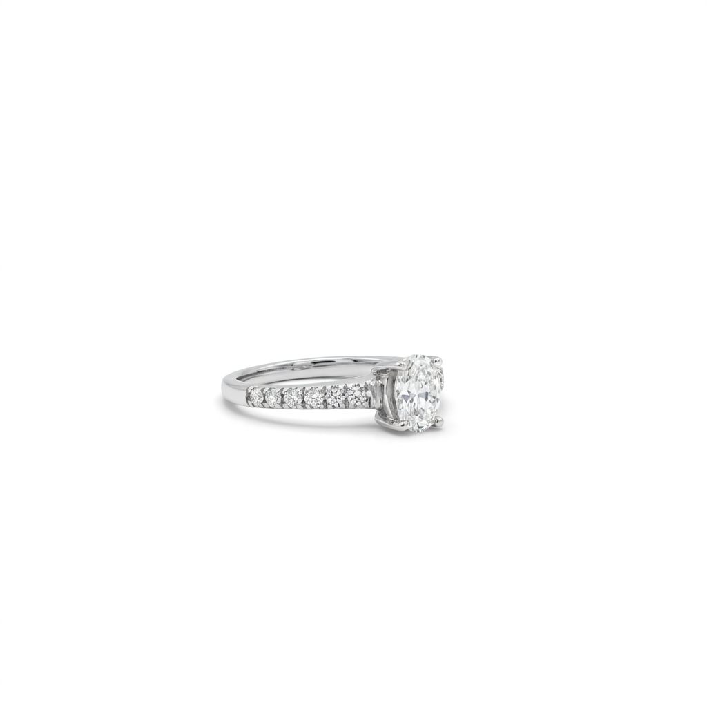14K White Gold Engagement Ring, set with 1 Oval Diamond (0.52ct, E, SI) and 12 Round Diamonds (total 0.25ct)