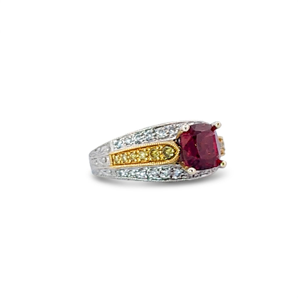 18K Dual White/Yellow Gold Engagement Ring, set with 1 Cushion Red Spinel (1.45ct, Loupe Clean), 12 Round Yellow Diamonds (0.12ct total, VS2), and 26 Round E Colorless Diamonds (0.20ct total, VS2). GIA-5231573527